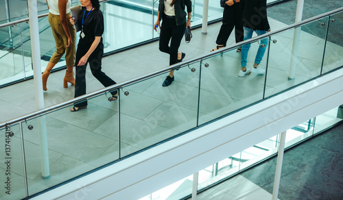 Photography Corporate professionals walking in modern office building