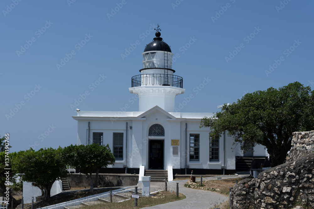 The historic Eluanbi Lighthouse stands tall in Taiwan, guiding ships and offering stunning coastal views.