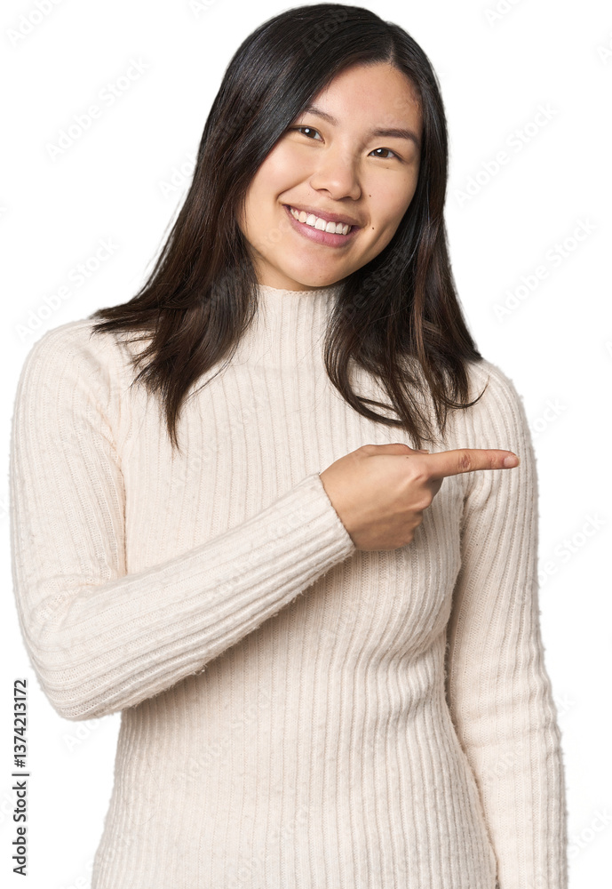 Young Chinese woman smiling and pointing aside, showing something at blank space. Young Chinese woman smiling and pointing aside, showing something at blank space.