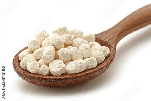 Wooden spoon with white supplement cubes on clean surface showing precision dosage concept and minimalist pharmaceutical product layout in modern health and wellness presentation