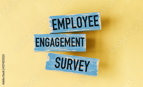 Three wooden blocks with the words employee engagement survey written on them