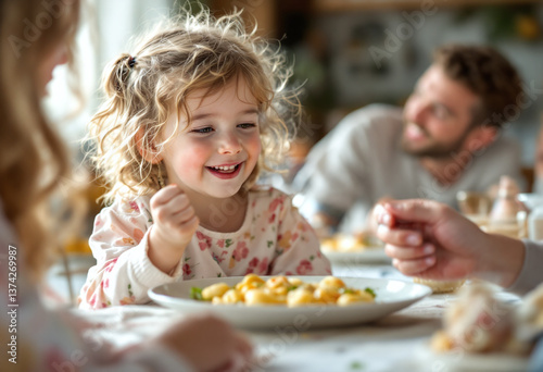 Happy child enjoying a meal with family at home  