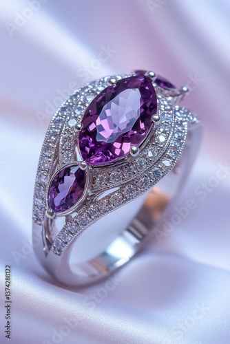 Elegant amethyst ring with diamond accents on soft silk fabric showcasing luxury jewelry design and precious gemstone in a studio setting