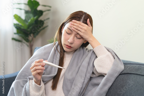 Wallpaper Mural Female sick woman checking her body temperature have a high fever feeling headache. Torontodigital.ca