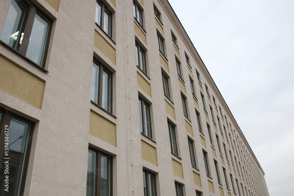 A beautiful balcony on a building with lovely arched windows A beautiful balcony on a building with lovely arched windows