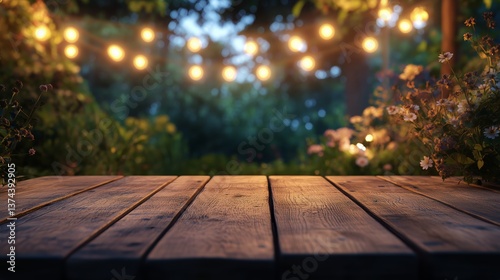 Wooden Table Under Warm Outdoor Lights in a Tranquil Garden Setting During Tw...