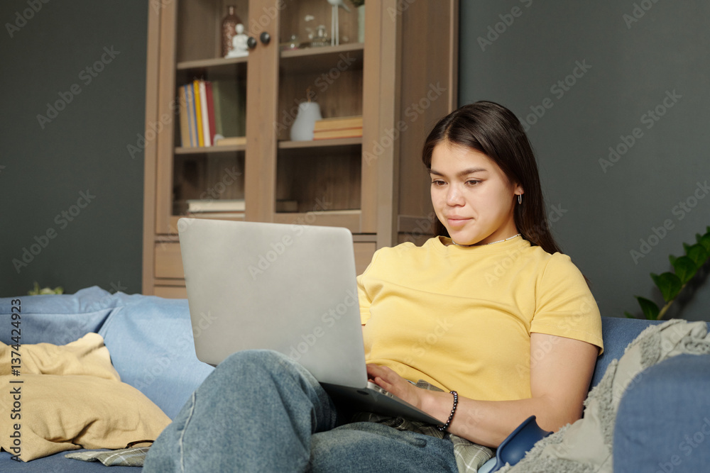 Young Woman in Yellow T-shirt Working on Laptop Young Woman in Yellow T-shirt Working on Laptop