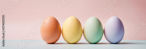 Four Colorful Easter Eggs in Pastel Shades on a Multicolored Background

