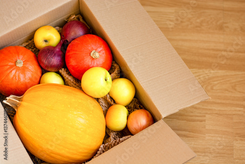 A set of products in a packaging cardboard box, vegetables for home delivery, copy space. High quality photo