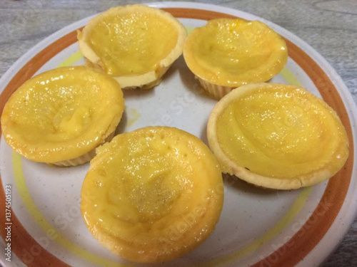 Photography lemon meringue pie, egg tarts on vintage plate on the table