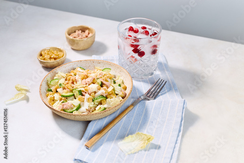 Fresh summer salad with tuna and water of red berries