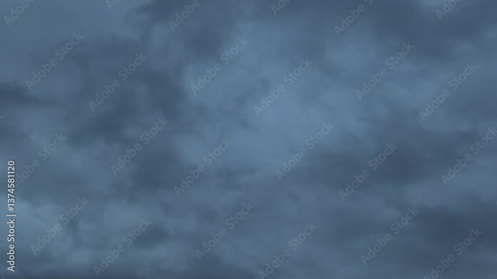 Strange cloud with shades of gray and blue at dusk Strange cloud with shades of gray and blue at dusk