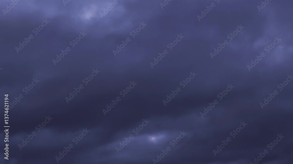 Blue clouds moving in the pink sky