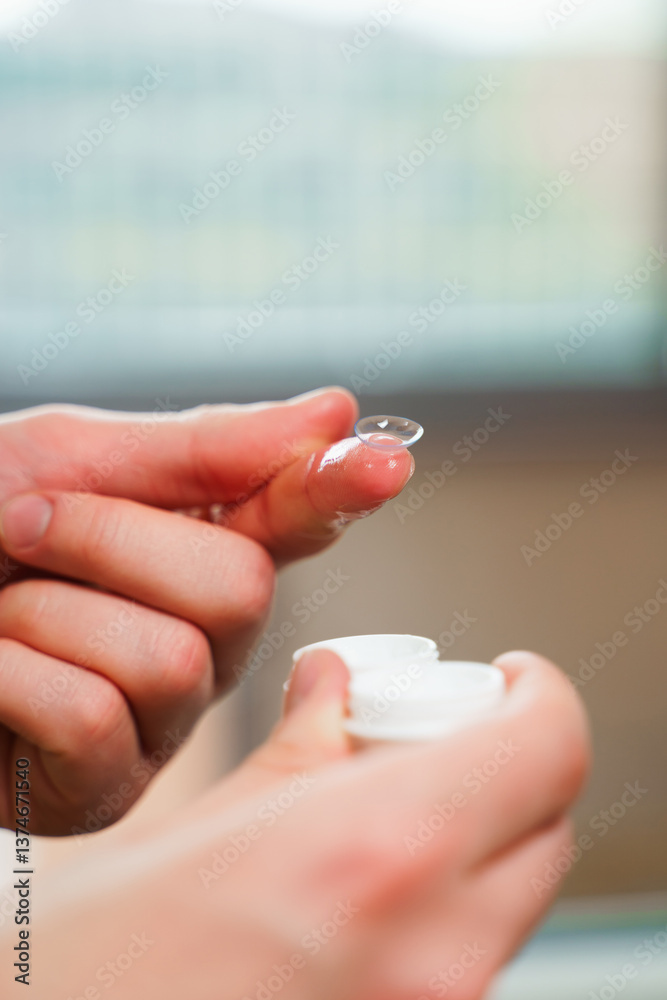 Eyesight correction with optical lens. Closeup contact lens for vision correction in hands. Eyesight correction with optical lens. Closeup contact lens for vision correction in hands.