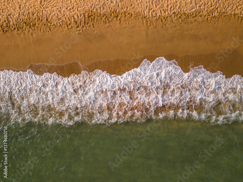Aerial view of a beach and sea in Frejus, France shot with a drone