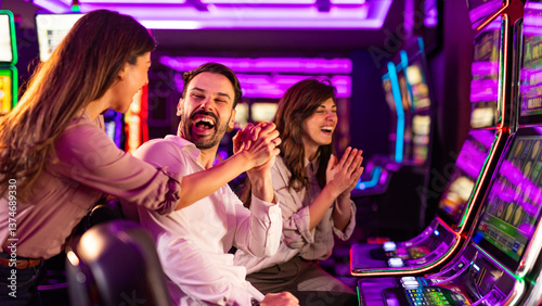 Canvas Print Friends Celebrating a Win at the Casino Slot Machines Vibrant Setting