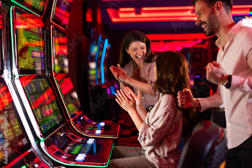 Obraz na płótnie Group of Friends Celebrating at Slot Machines in a Vibrant Casino w salonie
