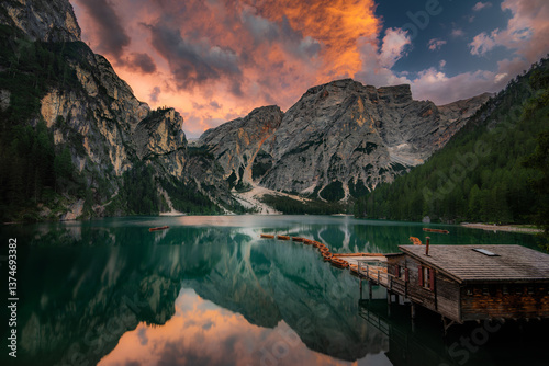Lago di Braies, Pragser Wildsee. Beautiful sunset with clouds in Dolomites mountains. Epic blue lake, mountain, cliffs, rocks, forest. Premium landscape from pure nature, Dolomiti, Alps, Italy