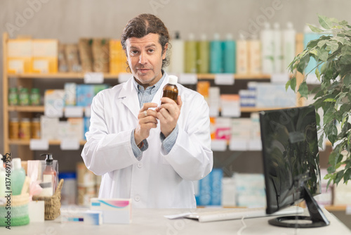 In sales area of pharmacy, man consultant sells expectorant syrup. Healthcare worker advertises safe remedy for symptom relief.