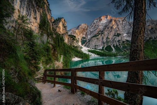 Lago di Braies, Pragser Wildsee. Beautiful sunset with clouds in Dolomites mountains. Epic blue lake, mountain, cliffs, rocks, forest. Premium landscape from pure nature, Dolomiti, Alps, Italy