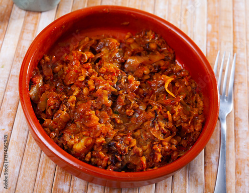 Delicious vegetarian dish of stewed cabbage with pearl barley with vegetables