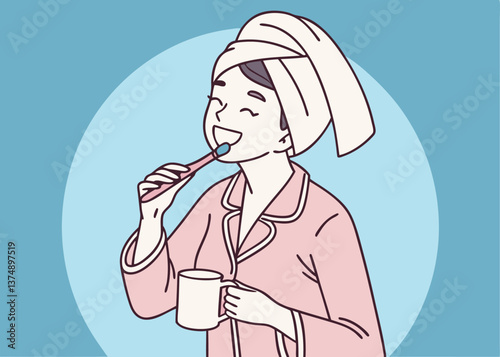 Asian woman in pink pajamas brushing her teeth while holding a white mug, with a towel wrapped on her head, smiling in front of a solid blue background, showing fun morning hygiene routine