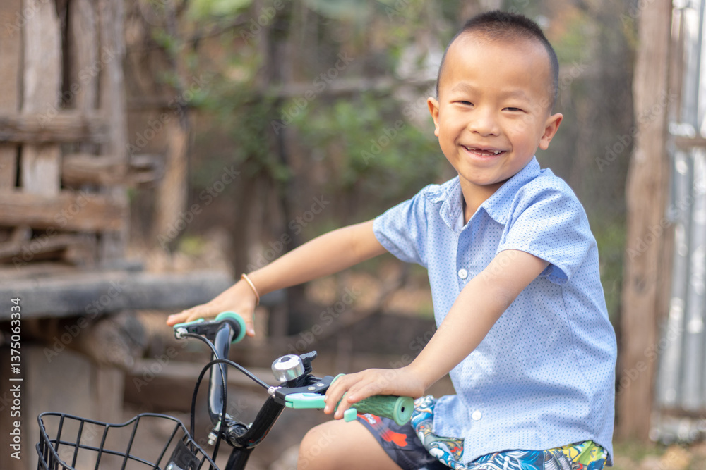 A young boy riding bicycle capture