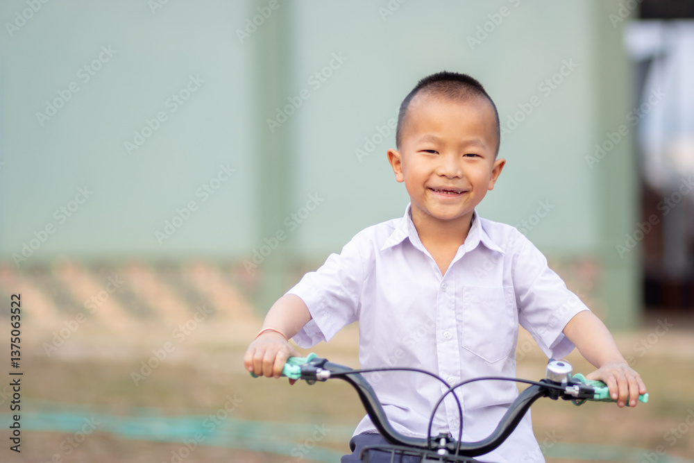 A young boy riding bicycle