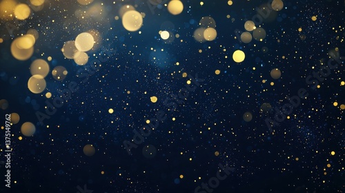 Abstract blue and gold bokeh background featu glitte particles and bright light orbs perfect for holiday celebratory designs or elegant luxury ing projects.