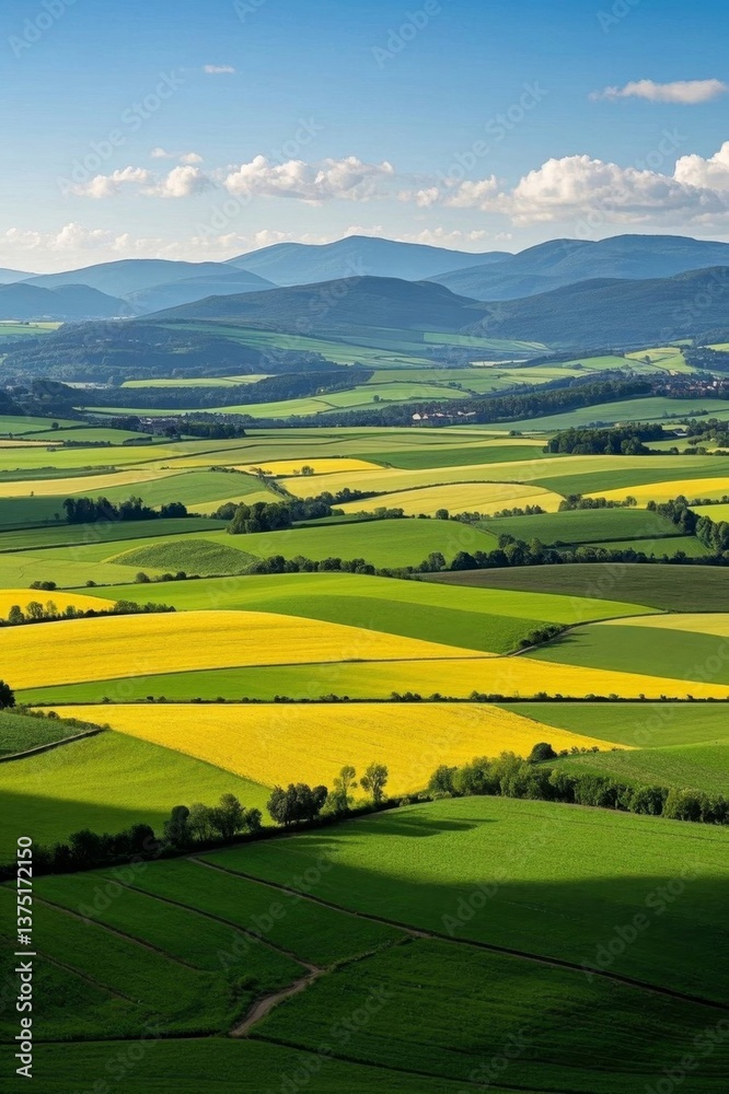 a view of a wide open field with a few hills in the distance a view of a wide open field with a few hills in the distance