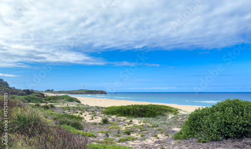 A view of City Beach in Wollongong, with Flagstaff Point Lighthouse in the distance. New South Wales, Australia. photo
