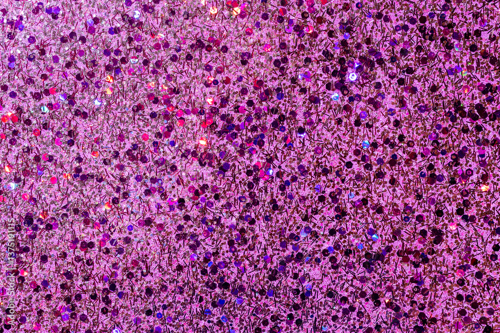 Fototapeta premium Full frame macro abstract texture background of sparkling multicolor pink glitter with copy space
