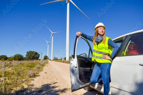Wallpaper Mural Environmental engineer inspecting wind turbines for renewable energy and sustainability Torontodigital.ca