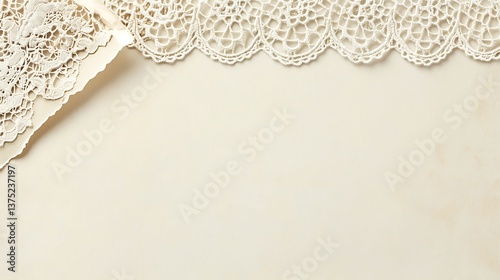 Elegant cream paper bordered by delicate white lace