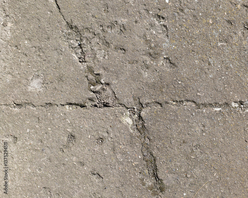 Background of destroyed concrete path, gray concrete, concrete texture, close-up. Natural photo. Old concrete slab