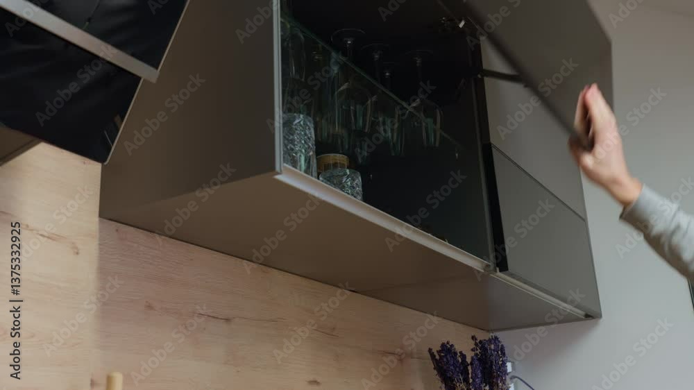 custom made wallpaper toronto digitalMan opens upper kitchen cabinet and takes drinking glass. Hand opens cupboard with transparent glasses