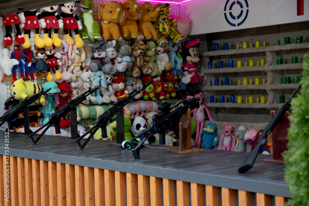 Fototapeta premium Toys and weapons in the prize shooting range