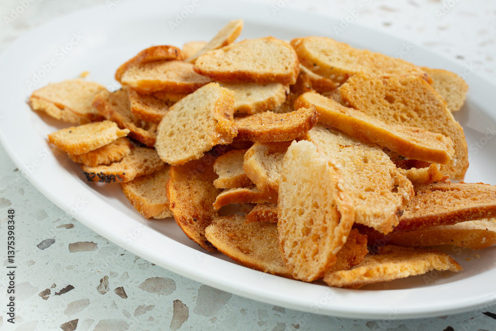A view of a pile of bagel chips on a plate. A view of a pile of bagel chips on a plate.