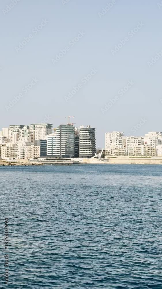 Archipelago, view of the modern town on the horizon and small yachts, architecture and yacht port, vertical video landscape, seascape. Archipelago, view of the modern town on the horizon and small yachts, architecture and yacht port, vertical video landscape, seascape.