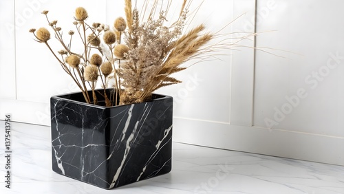 Minimalist Black Marble Planter with Exotic Dried Florals, Isolated on a White Background, perfect for contemporary interior styling and luxury botanical decor, Luxury Home Accessory Stock Image