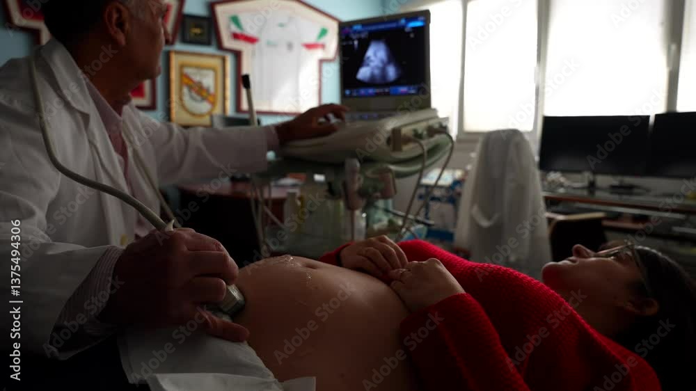 Gynecologist locating baby with ultrasound machine. Close-up on belly, 4K