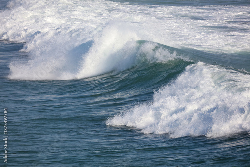 The ocean is calm and the waves are small