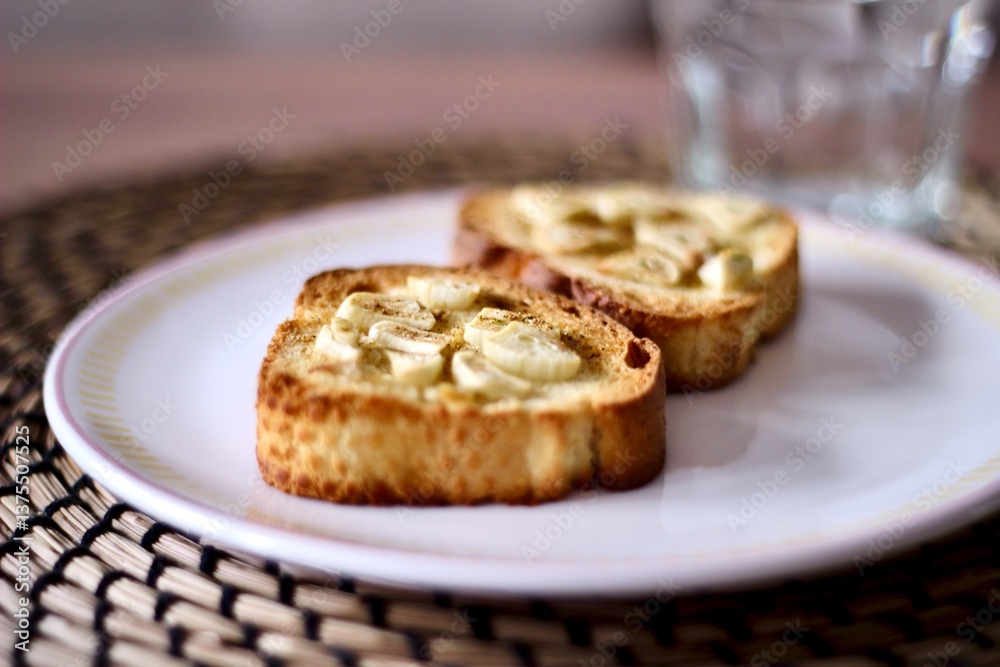 Close-up of a plate of corn bruschetta with olive oil and slices of garlic Close-up of a plate of corn bruschetta with olive oil and slices of garlic