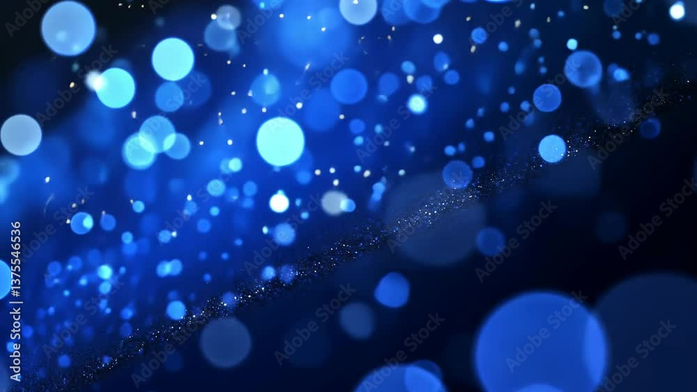Swirling blue bokeh lights create a mesmerizing visual effect in a dark background setting during the evening