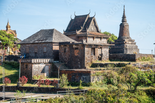 An impressive building atop a lovely hill, surrounded by trees, Bokor National Park