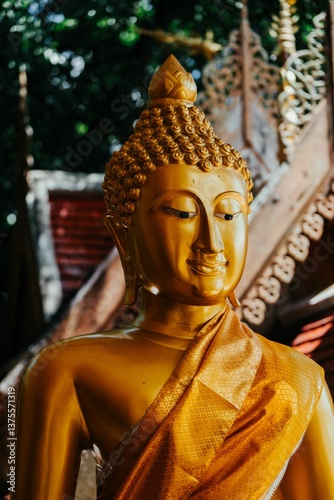 Golden Buddha statue with intricate details.