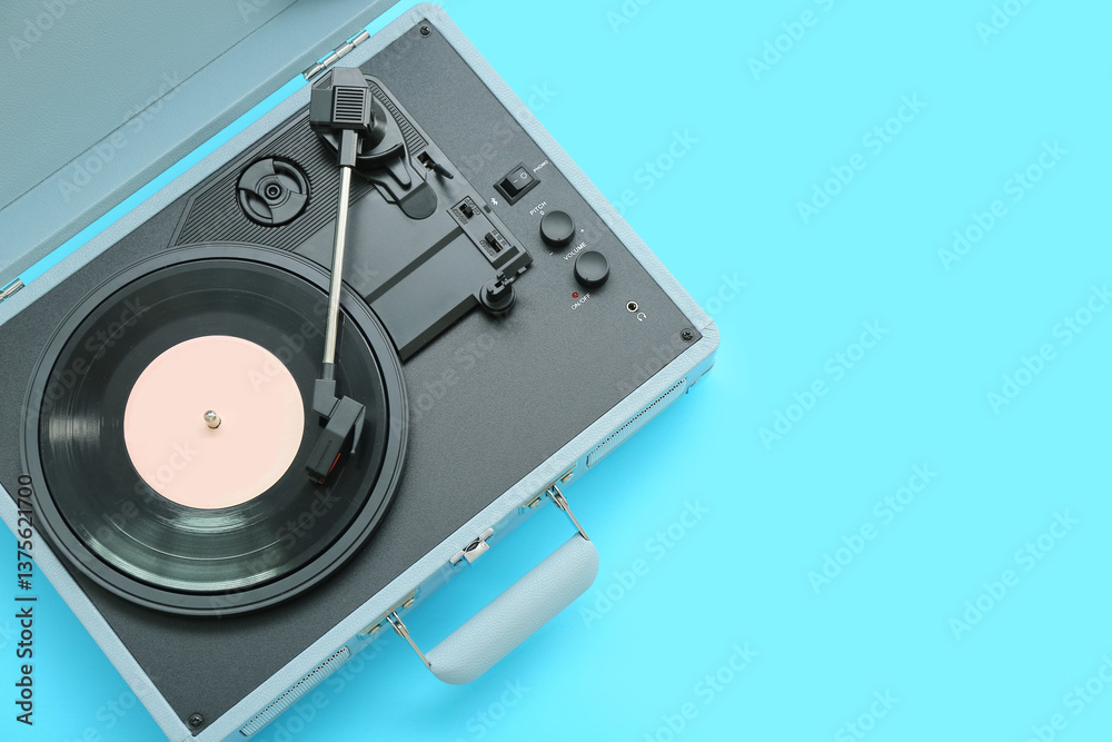 Record player with vinyl disk on blue background Record player with vinyl disk on blue background