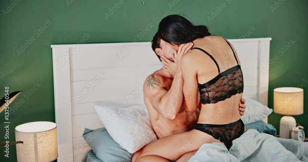 Home, couple and kiss in bedroom, love and sex with desire, erotic and passion with happiness. Apartment, relax and man with woman, intimacy and bonding together for honeymoon, seductive and love