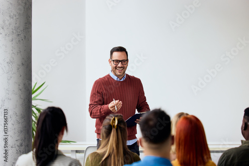 Obraz na plátně Instructor Leading Motivational Seminar with a Group of Diverse Participants