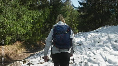 Backpacker On The Trails Covered With Snow In Tatras Mountain In Europe. Slow Motion Shot